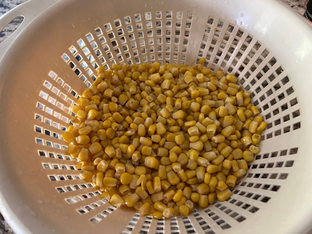 Canned corn, strained before going on Blackstone